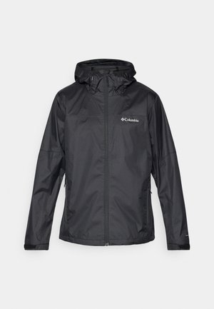 Black waterproof jacket with a zip closure, adjustable hood, and two side pockets. Features a smooth texture and the Columbia logo on the chest.