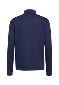 Veste longue à manches en bleu marine, réalisée en matière lisse, avec un col montant et des poignets côtelés. La vue arrière montre un design simple sans embellissements.