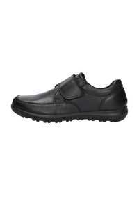 Zwarte leren schoen met een ronde neus, een klittenbandsluiting en een gestructureerde rubberen zool met grip.