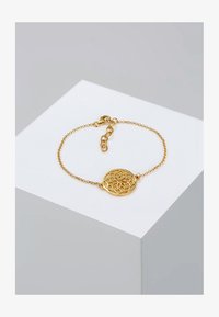 Seleccionado, gold-coloured