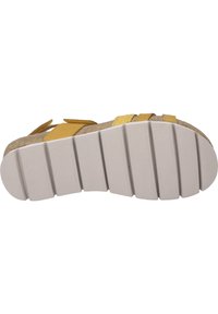 Sandaalzool met een gestructureerd beige materiaal, een dikke witte rubberen basis en meerdere ribbels voor grip. Accentueert met gele banden.