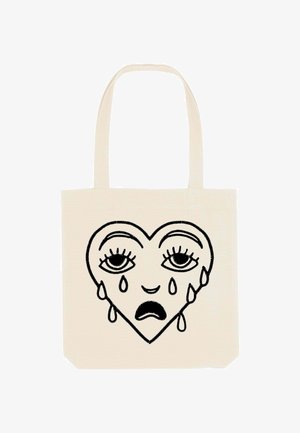 Borsa tote in tela color crema con un design di cuore nero che presenta occhi tristi e lacrime. Il design è centrato e contornato da linee spesse.