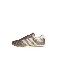 Brown and cream slip-on athletic shoe with a smooth leather upper, ribbed toe design, and three stripes accent on the side.