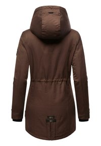 Brown parka jacket with a large hood, cinched waist, and textured fabric. Features elastic cuffs and branded accents near the hem.
