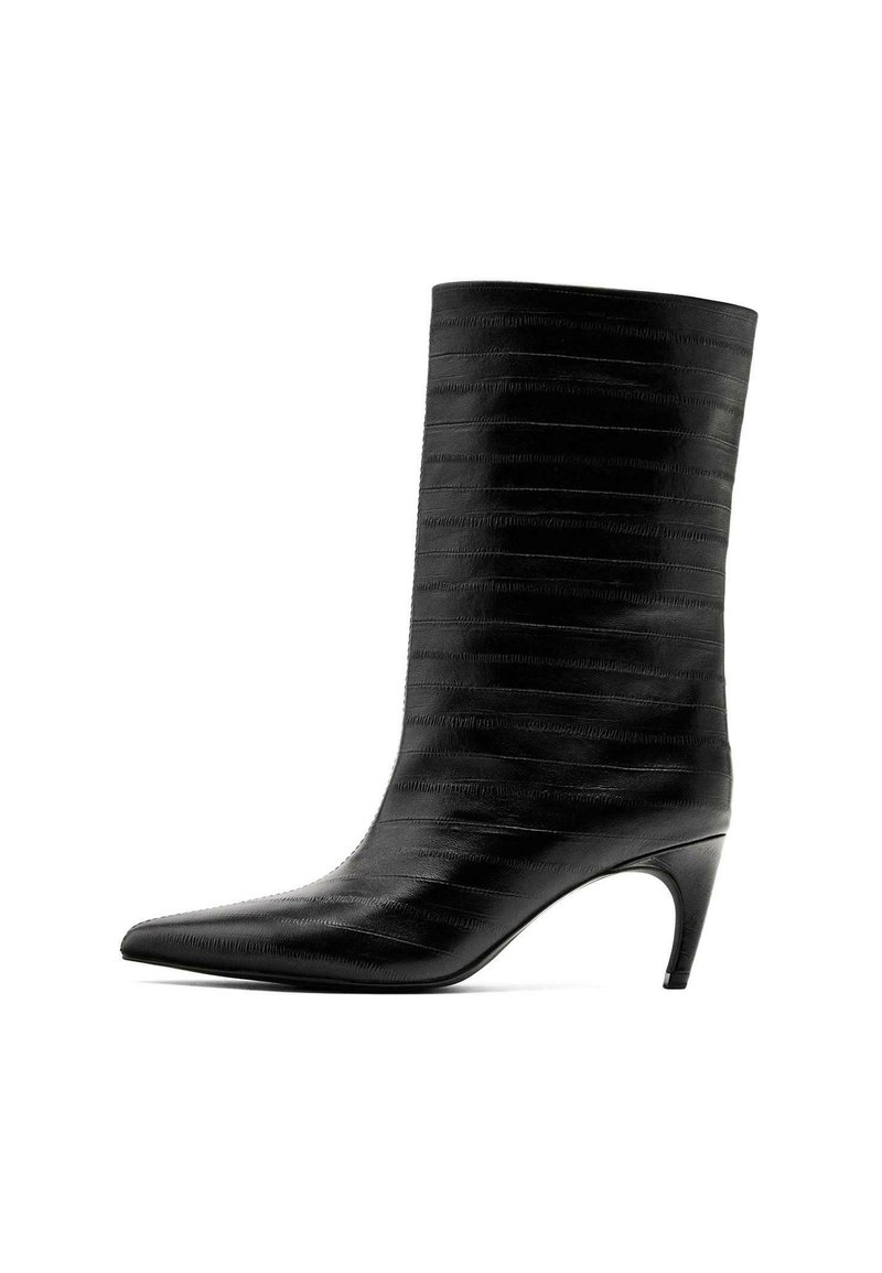 Black ankle boot made of textured leather, featuring a pointed toe and a slender heel. Vertical lines adorn the shaft for added detail.