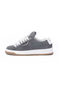 Gray suede sneaker with white rubber sole and laces. Features perforated design on the sides and brand logo on the side, minimalistic style.