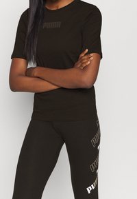 Puma T-shirt med print - black