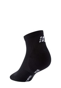 Calzino nero alla caviglia con polsino a costine, caratterizzato da un branding bianco sul lato. Il tessuto è liscio con un design della punta e del tallone rinforzato.