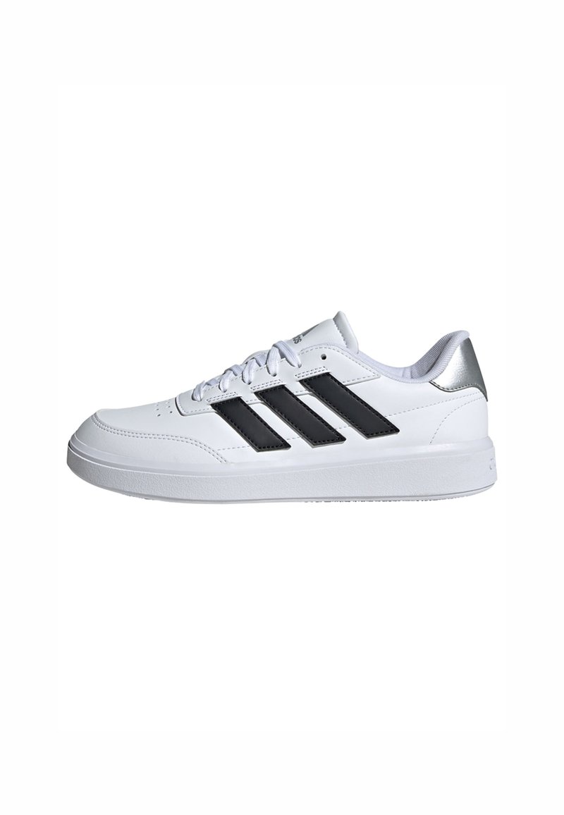 White athletic sneaker with black three-stripe design, textured leather upper, round toe, and silver accents on the heel, flat rubber sole.