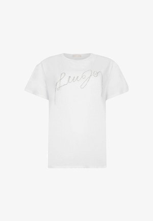 Valkoinen puuvillateepaita, jossa on lyhyet hihat, pyöreä pääntie ja edessä kimaltava hopeinen kirjoitusmuotoilu. Silkkinen rakenne, kevyt.