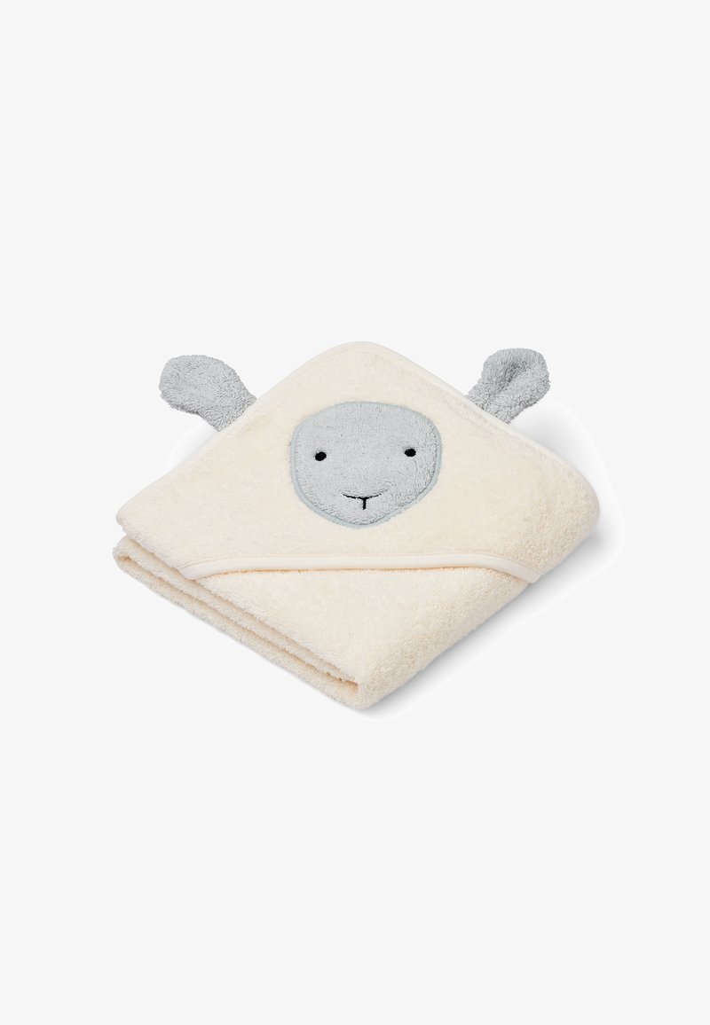 Krēmveida dvielis ar pelēkiem akcentiem, veidots kā dzīvnieks ar kapuci. Tam ir pelēks sejai, ar izšūtām acīm un ausīm malās. Mīksta tekstūra.