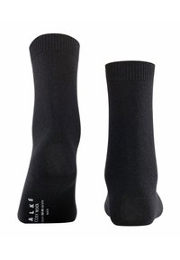Schwarze Wollsocken mit strukturiertem Strick, gerippten Bündchen und verstärkten Fersen- und Zehenbereichen, die den Markennamen und Pflegehinweise an der Seite tragen.