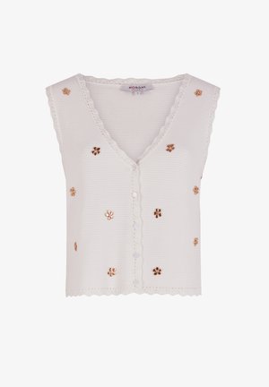 Weißer ärmelloser Cardigan mit gewelltem Ausschnitt, der dekorative goldene Blumenverzierungen und einen Knopfverschluss vorne aufweist.