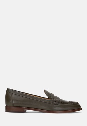 Dark green leather loafers with a rounded toe, stitching details on the vamp, and a wooden stacked heel for stability.