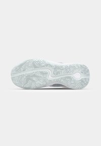 Semelle de chaussure avec un motif ondulé texturé en gris clair et blanc, présentant un design de lignes courbes lisses intégré dans la semelle.
