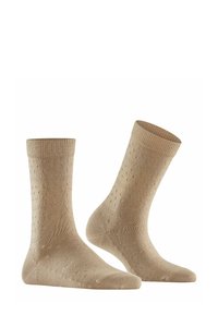 Beżowe skarpetki z fakturowanym wzorem, z prążkowanym ściągaczem, gładkim dzianinowym ciałem i wzmocnionym palcem, odpowiednie do codziennego noszenia.