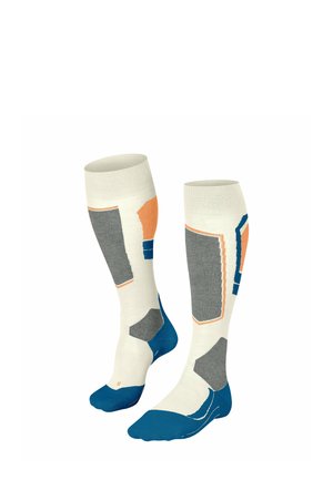 Kniehohe Socken in Creme, Grau, Blau und Orange mit geometrischen Mustern. Mit verstärkter Zehenpartie und Fußgewölbeunterstützung. Hergestellt aus weichem Strickmaterial.