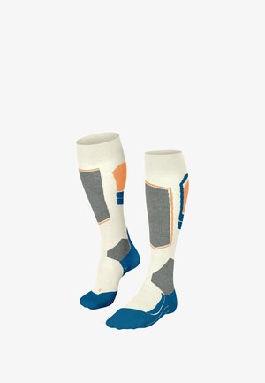 Kniehohe Socken in Creme, Grau, Blau und Orange mit geometrischen Mustern. Mit verstärkter Zehenpartie und Fußgewölbeunterstützung. Hergestellt aus weichem Strickmaterial.