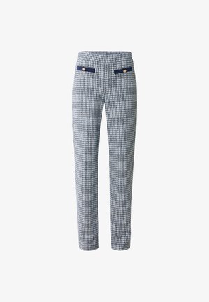 Pantaloni a quadri con un design aderente, realizzati in un tessuto texturizzato blu e bianco. Presentano due tasche frontali con dettagli in blu navy e bottoni.