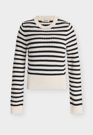 Pull en tricot à manches longues rayé crème et noir avec poignets et ourlet côtelés, présentant un motif texturé et un col rond.