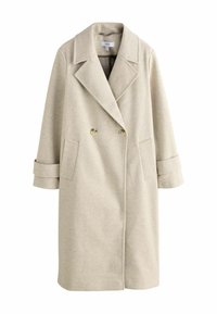 Palton din lână beige deschis, cu două rânduri de butoane, rever larg, două buzunare frontale și curele la manșetele ușor lungi.