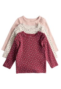 Set aus drei langärmeligen Oberteilen in Pastellrosa, Creme mit floralem Muster und Burgunder mit kleinen Blumenprints; gerippte Textur.