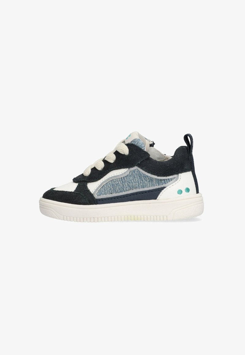 Sneaker with a mix of navy suede and blue denim panels, white rubber sole, cream laces, and teal accent dots on the heel.