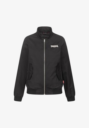 Black bomber jacket with a stand collar, zip front, two side pockets, and a small logo on the chest. Features ribbed cuffs and hem.