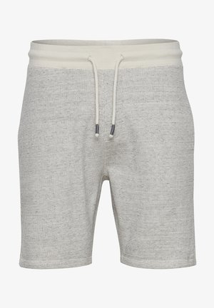 Heledad hallikas lühikesed püksid, millel on nööridega vöökoht ja kaks külgtaskut, millel on kogu kangas peen muster.