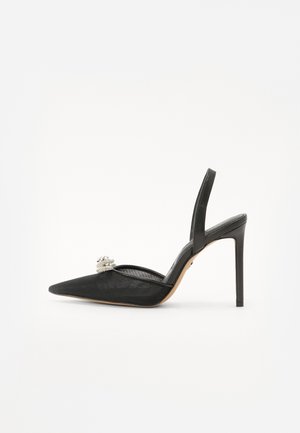 Schwarzer Slingback mit hohen Absätzen und spitz zulaufender Zehenpartie, aus Netzgewebe und mit einer dekorativen silbernen Verzierung auf dem Schaft.