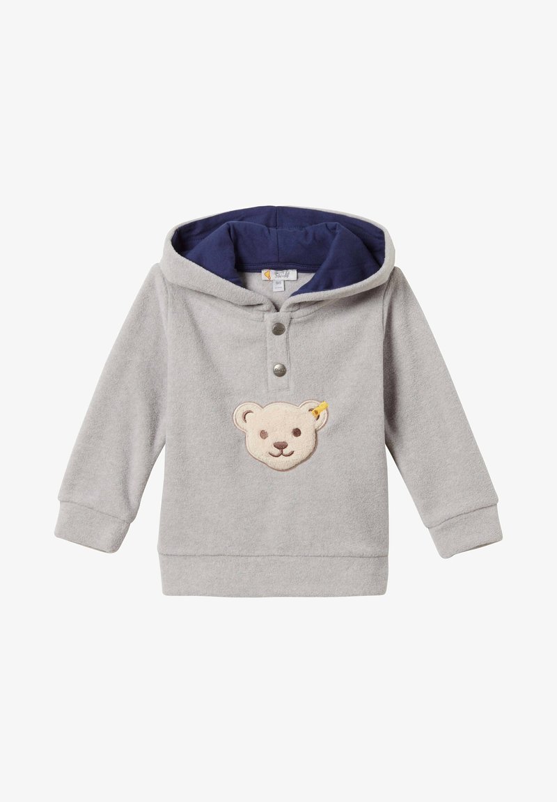 Hoodie en polaire grise avec une capuche intérieure bleu marine, présentant une appliqué en forme de tête d'ours au centre et deux boutons-pression au niveau du col.