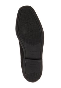 Semelle de chaussure en daim noir avec motif adhérent en caoutchouc texturé. Comprend un talon rectangulaire et un logo embossé sur la semelle intérieure. Taille 37.