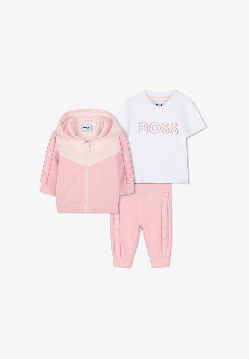 Pink three-piece children's tracksuit with zip-up hooded jacket, white T-shirt with "BOSS" logo, and matching pink pants with logo accents.