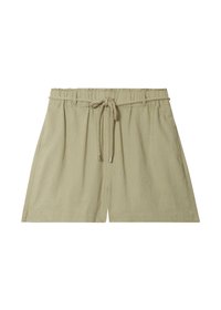 Beige linen shorts featuring an elastic waistband with a drawstring, side pockets, and a relaxed fit. Smooth texture and simple design.