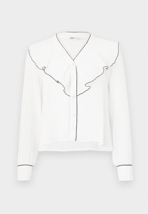 Camisa branca de manga longa com colarinho franzido com borda preta, fecho frontal com botões e detalhes pretos nas mangas.