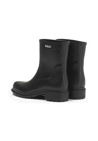 Black rubber ankle boots with a smooth texture, rounded toe, and thick sole featuring deep treads. "AIGLE" logo on the front.