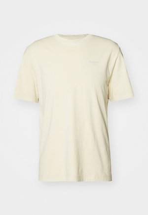 Īsām piedurknēm krēma krāsas T-krekls, izgatavots no mīksta kokvilnas auduma, ar apaļu kakla izgriezumu un mazu logo, drukātu gaišā krāsā uz krūtīm.