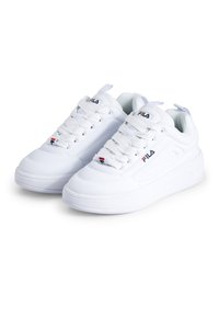 White athletic shoes with a smooth texture, rounded toe, and raised sole. Features laces and Fila logo in red and blue accents.