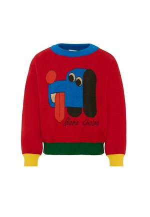 Czerwony sweter z dzianiny z graficznym wzorem niebieskiego psa z wystawionym językiem. Akcenty w kolorze niebieskim, zielonym i żółtym na kołnierzyku i mankietach.