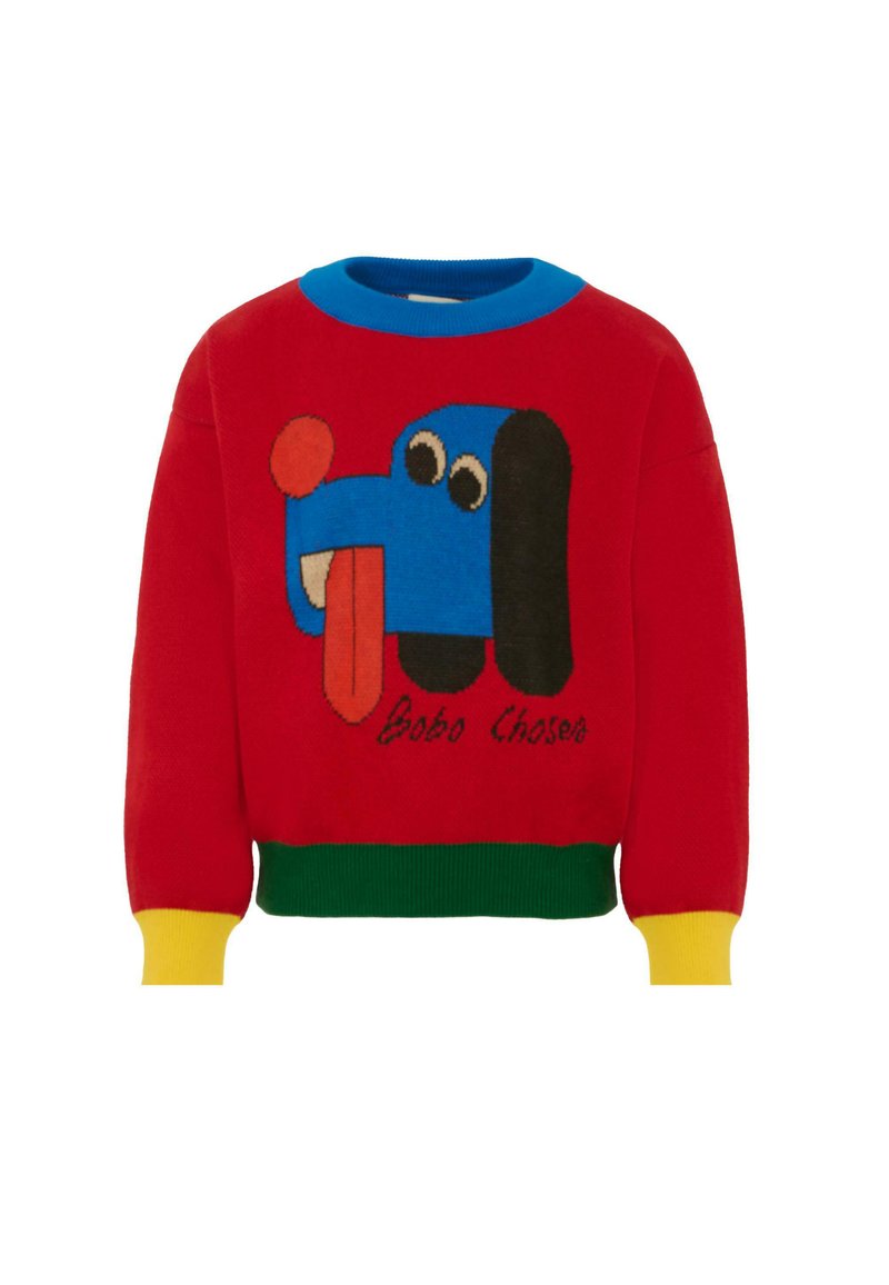 Maglione rosso lavorato a maglia con una grafica di un cane blu con la lingua di fuori. Accenti in blu, verde e giallo sul colletto e sui polsini.