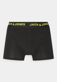 Schwarze Boxer-Shorts aus weicher Baumwolle mit einem dehnbaren Bund, der ein auffälliges gelbes "JACK & JONES"-Logo trägt. Glatte Textur ohne Muster.