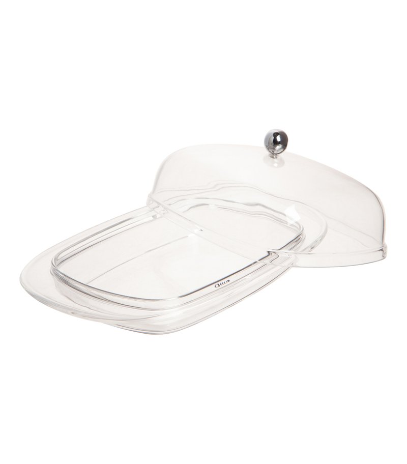 Przezroczysta plastikowa kopuła o zaokrąglonym wierzchołku i metalowym uchwycie, z szeroką podstawą i gładkimi, zaokrąglonymi krawędziami dla łatwego użytkowania.