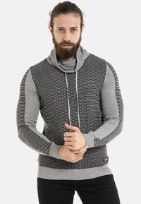 Grau- und schwarz gemusterter Pullover mit Cowl-Neck, langen Ärmeln und geripptem Saum. Verfügt über ein horizontales Streifendesign und eine Kordelzug-Detail.