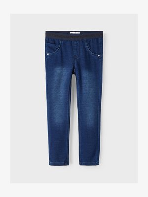 Mørkeblå denim leggings med en sort elastisk talje, der har to frontlommer og et slankt, tapered ben design.