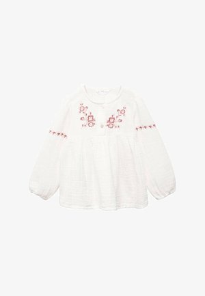 Blouse blanche à manches longues avec col rond, boutons sur le devant et broderie florale rose sur la poitrine et les manches.