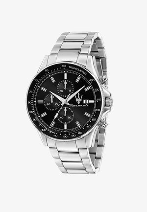 Sølv rustfrit stål chronograf ur med en sort urskive, hvide time markører og en tachymeter; har tre sekundære skiver og datovisning.