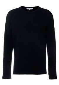 Svart långärmad crewnecktröja med ribbad textur och Calvin Klein Jeans-märke inuti kragen samt ett märke på vänster  ärm.