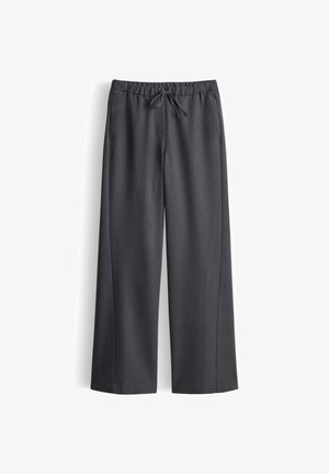 Pantaloni grigi a gamba larga con vita elasticizzata e coulisse. Tessuto liscio con un taglio dritto e senza motivi o dettagli visibili.
