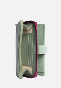 Green leather wallet with a maroon zipper, featuring multiple card slots and compartments. Smooth texture with a structured design.