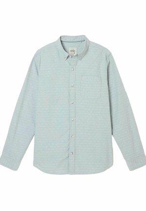 Helehall sinise tooniga pikkade varrukatega särk, millel on nööbitav krae. Varustatud ühe rinnataskuga ja valge täpilise mustriga tekstuuriga.